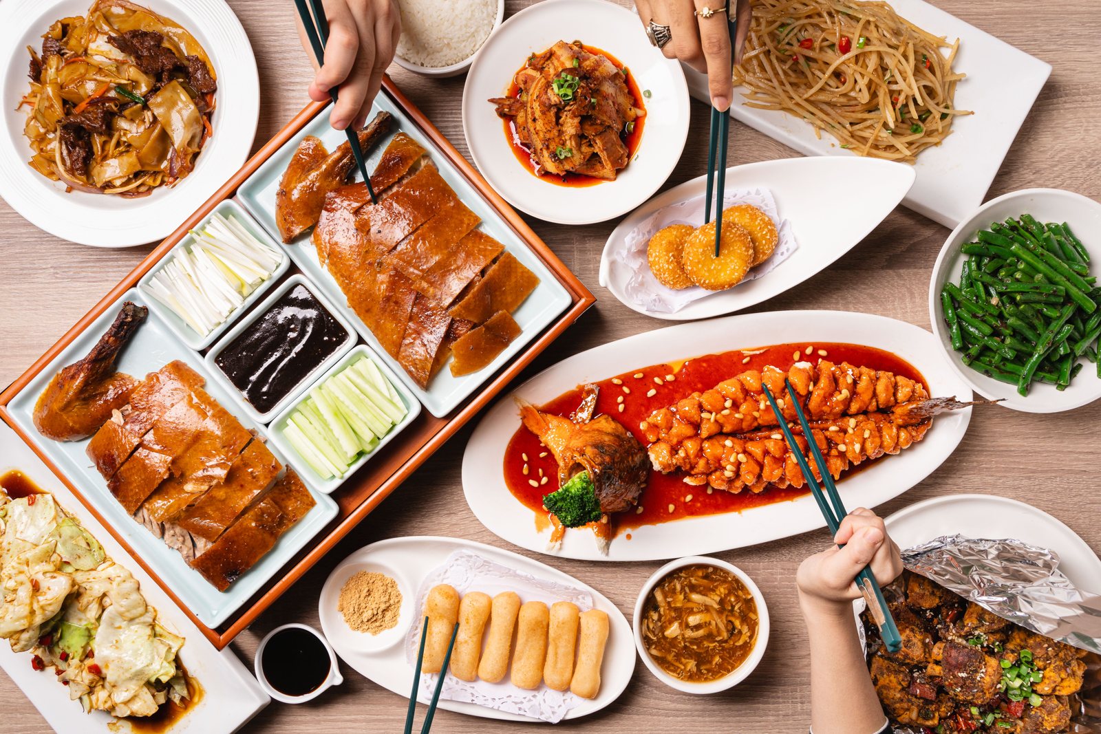 A full table at Lao Sze Chuan Baltimore: Peking duck, dumplings, noodles and Sichuan dishes