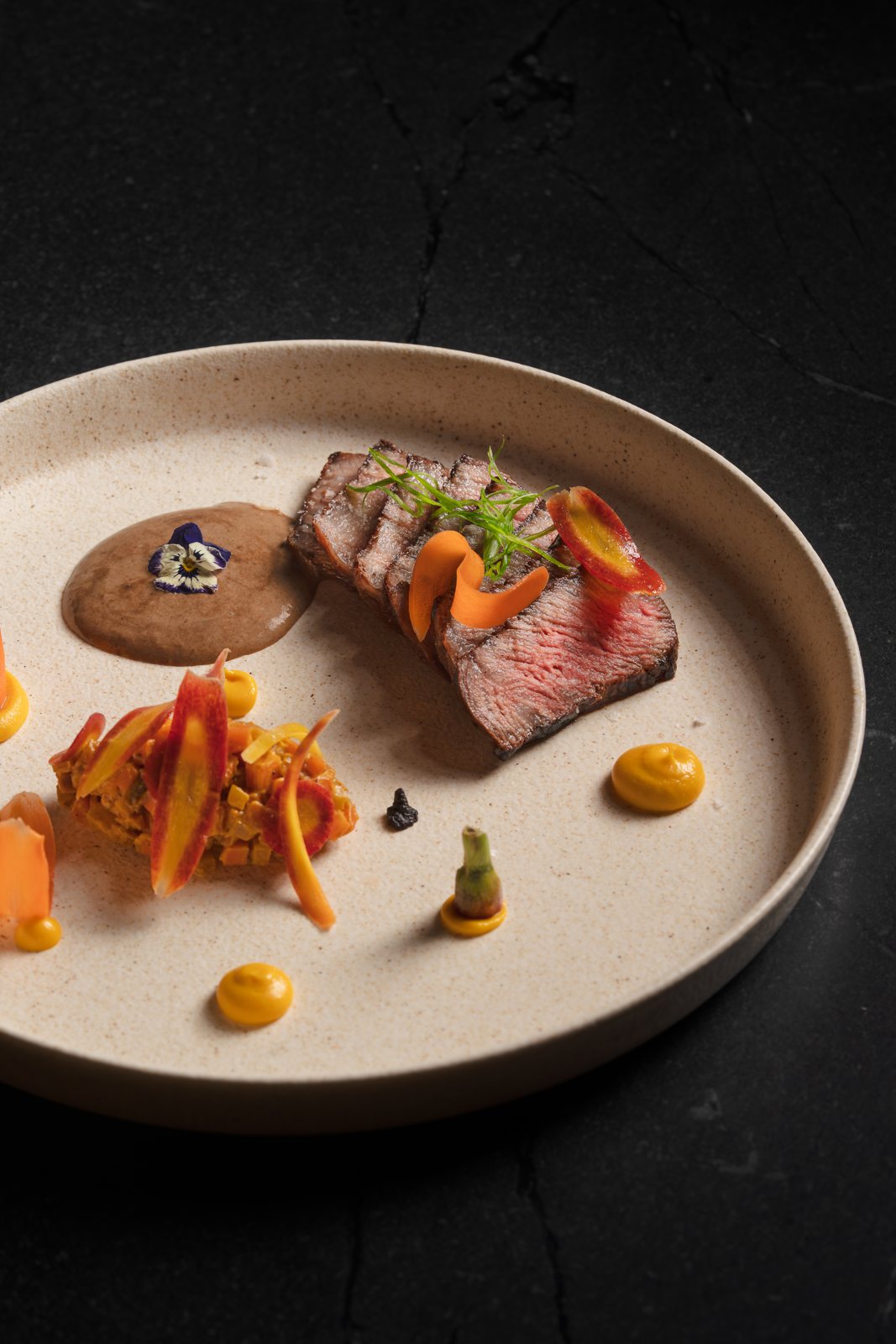 A5 wagyu with carrot, black garlic miso and black garlic dashi at MUI Supper Club